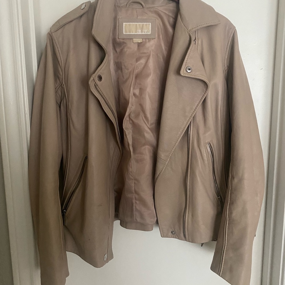 100% leather motorcycle jacket - Michael Kors size XL fits 12/14 best.